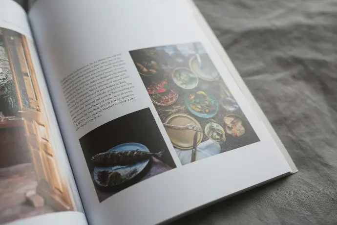 an open book with pictures of food on it